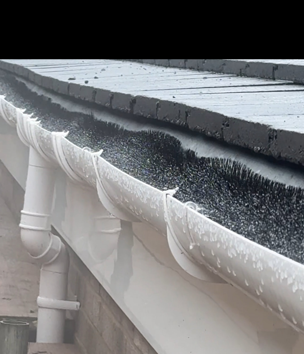 SkyVac gutter cleaning service by CLS Roofing Specialists.